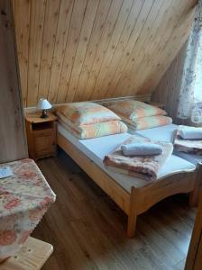 Postel nebo postele na pokoji v ubytování U Białasów