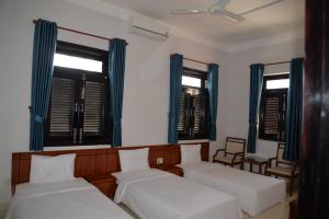 Postel nebo postele na pokoji v ubytování Resort Hoa Sim Da Lat