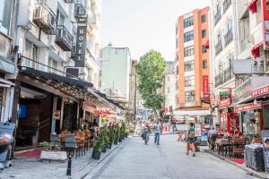 a city street with people walking down the street at Istanbul Sirkeci Hotel in Istanbul