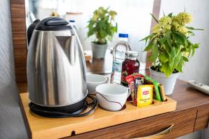 a coffee maker on a wooden counter with plants at Istanbul Sirkeci Hotel in Istanbul