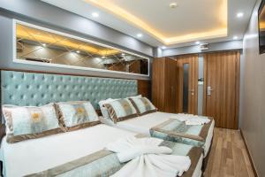 a bedroom with two beds on a yacht at Istanbul Sirkeci Hotel in Istanbul