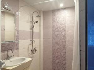 a bathroom with a shower and a sink at Primorski Briz Guest House in Primorsko +31 photos