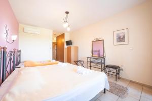 Postel nebo postele na pokoji v ubytování Hotel Erodios