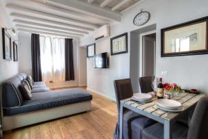 a living room with a couch and a table at Al Giardino delle Rose in Florence