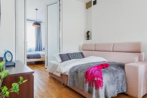 Łóżko lub łóżka w pokoju w obiekcie Dworzec Centralny P&O Serviced Apartments