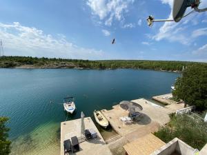 a view of a lake with two boats in the water at Misho Apartments in Kruševo
