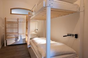 Posteľ alebo postele v izbe v ubytovaní ART Hostel & Apartments