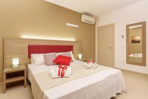 Posteľ alebo postele v izbe v ubytovaní Travini Hotel Residence