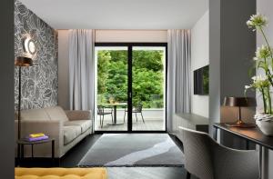 Televiisor ja/või meelelahutuskeskus majutusasutuses Bianca Relais, by R Collection Hotels