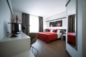 Posteľ alebo postele v izbe v ubytovaní Bonotto Hotel Palladio