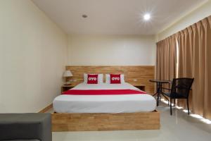 Cama o camas de una habitación en OYO 1136 Maple Mansion