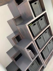 a shelving unit with lots of windows at LEA Barn in Żagań