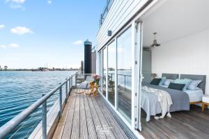 a bedroom on a boat on the water at Stella Maris in Olpenitz