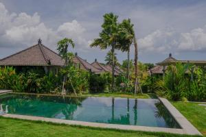 an image of a house with a swimming pool at Villa Alisha Pererenan Canggu in Canggu