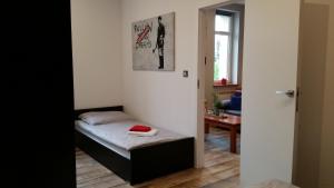 Posteľ alebo postele v izbe v ubytovaní Street Art Apartment