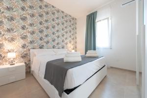 Posteľ alebo postele v izbe v ubytovaní Villa Livia - IsulaTravel
