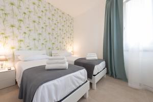 Posteľ alebo postele v izbe v ubytovaní Villa Livia - IsulaTravel