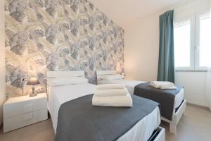 Posteľ alebo postele v izbe v ubytovaní Villa Livia - IsulaTravel