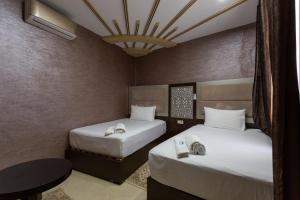 Ένα ή περισσότερα κρεβάτια σε δωμάτιο στο Hotel Jibal Chaouen