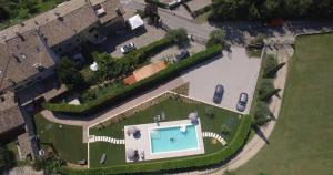 an overhead view of a house with a swimming pool at Villa Vaccari Garda in Garda