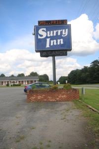 a sign for a swiminy inn in a parking lot at Surry Inn - Dobson - I-77 - Exit 93 in Dobson +34 photos