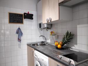 a kitchen with a sink and a counter top at Bonavista Studio with a Balcony - Calella in Calella