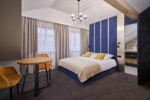 Posteľ alebo postele v izbe v ubytovaní Apartamenty Queen
