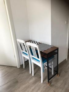 a table and two chairs sitting next to each other at Appartements in Basel - Leymen in Leymen