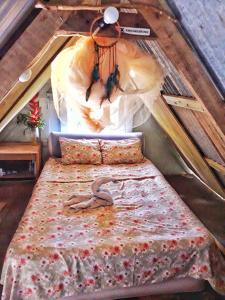 a bedroom with a bed in a attic at Tony's Offgrid Cabin Getaway in Scarborough