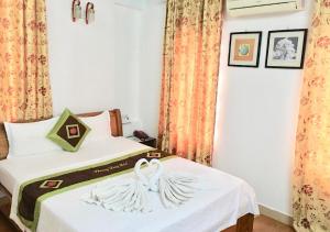 Voodi või voodid majutusasutuse Phuong Dong hotel toas