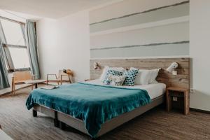 Postel nebo postele na pokoji v ubytování Baya Hotel