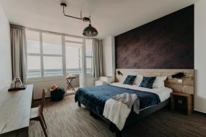 Postel nebo postele na pokoji v ubytování Baya Hotel