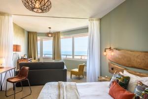 Postel nebo postele na pokoji v ubytování Baya Hotel