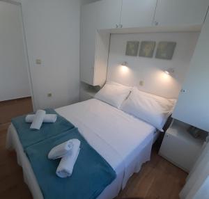 Postel nebo postele na pokoji v ubytování Apartman s pogledom