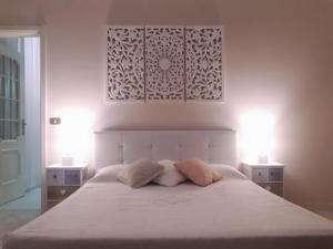 Un pat sau paturi într-o cameră la Villa Goria