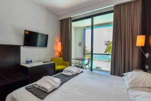 Postel nebo postele na pokoji v ubytování Quinta Mirabela - Design Hotel + 37 fotografií