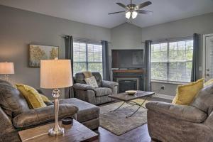 a living room with two couches and a fireplace at Branson Resort Condo - 2 Miles to Table Rock Lake! in Branson