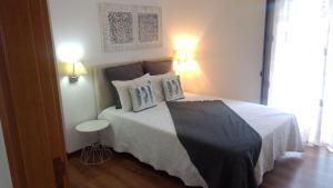 Uma cama ou camas num quarto em Meimoa Guesthouse