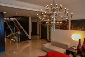 
a living room filled with furniture and lights at Quinta Mirabela - Design Hotel in Funchal
