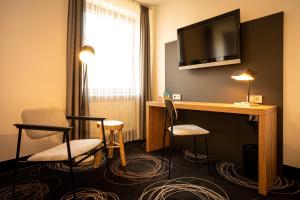 TV a/nebo společenská místnost v ubytování Hotel Rio