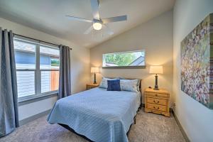 a bedroom with a bed and a ceiling fan at Bozeman Home with Deck Walk to Fishing, Hot Springs in Bozeman