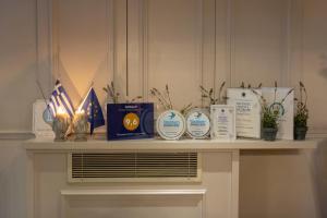 a table with some awards on top of it at Marpessa Hotel & Spa in Agrinion