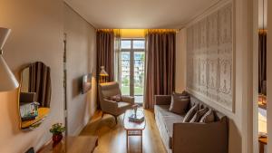 a living room with a couch and a table at Marpessa Hotel & Spa in Agrinion