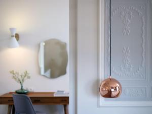 a room with a desk and a pendant light at Marpessa Hotel & Spa in Agrinion