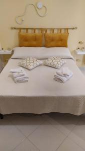 Postel nebo postele na pokoji v ubytování B&b regina del porto