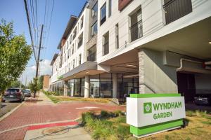 a building with a sign in front of it at Wyndham Garden North Bergen - Secaucus in North Bergen