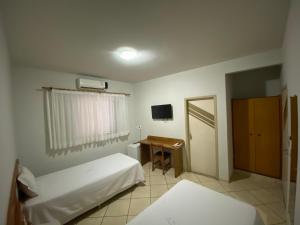Postel nebo postele na pokoji v ubytování Ônix Hotel