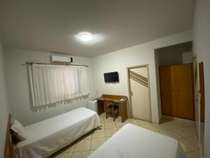 Postel nebo postele na pokoji v ubytování Ônix Hotel