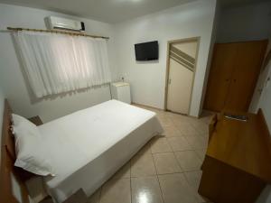 Postel nebo postele na pokoji v ubytování Ônix Hotel