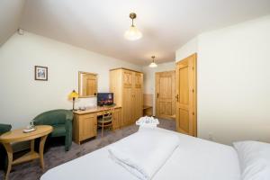 Postel nebo postele na pokoji v ubytování Hotel Zlaty Lev